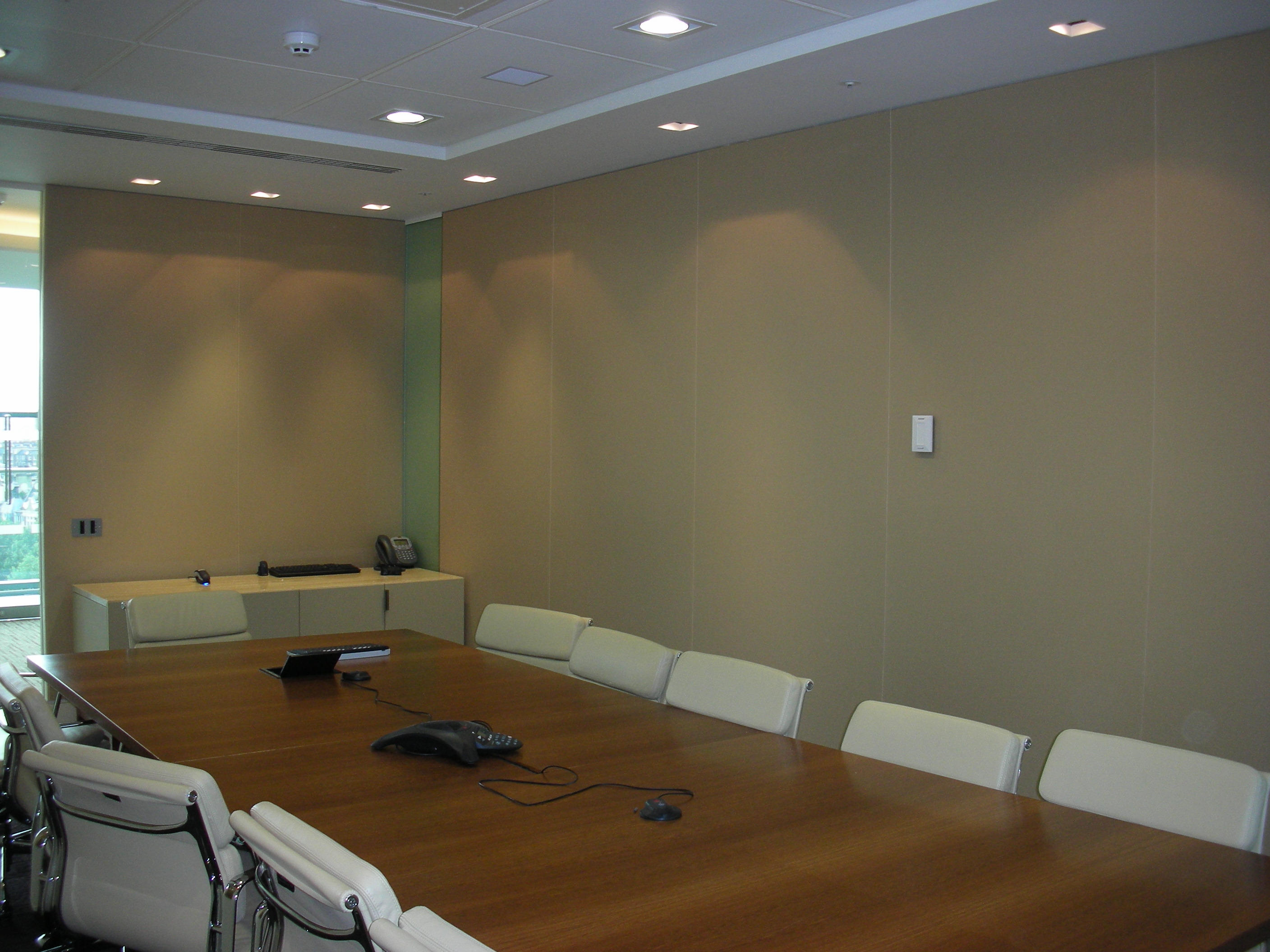 Modern conference room fitted with a stretch fabric acoustic wall system