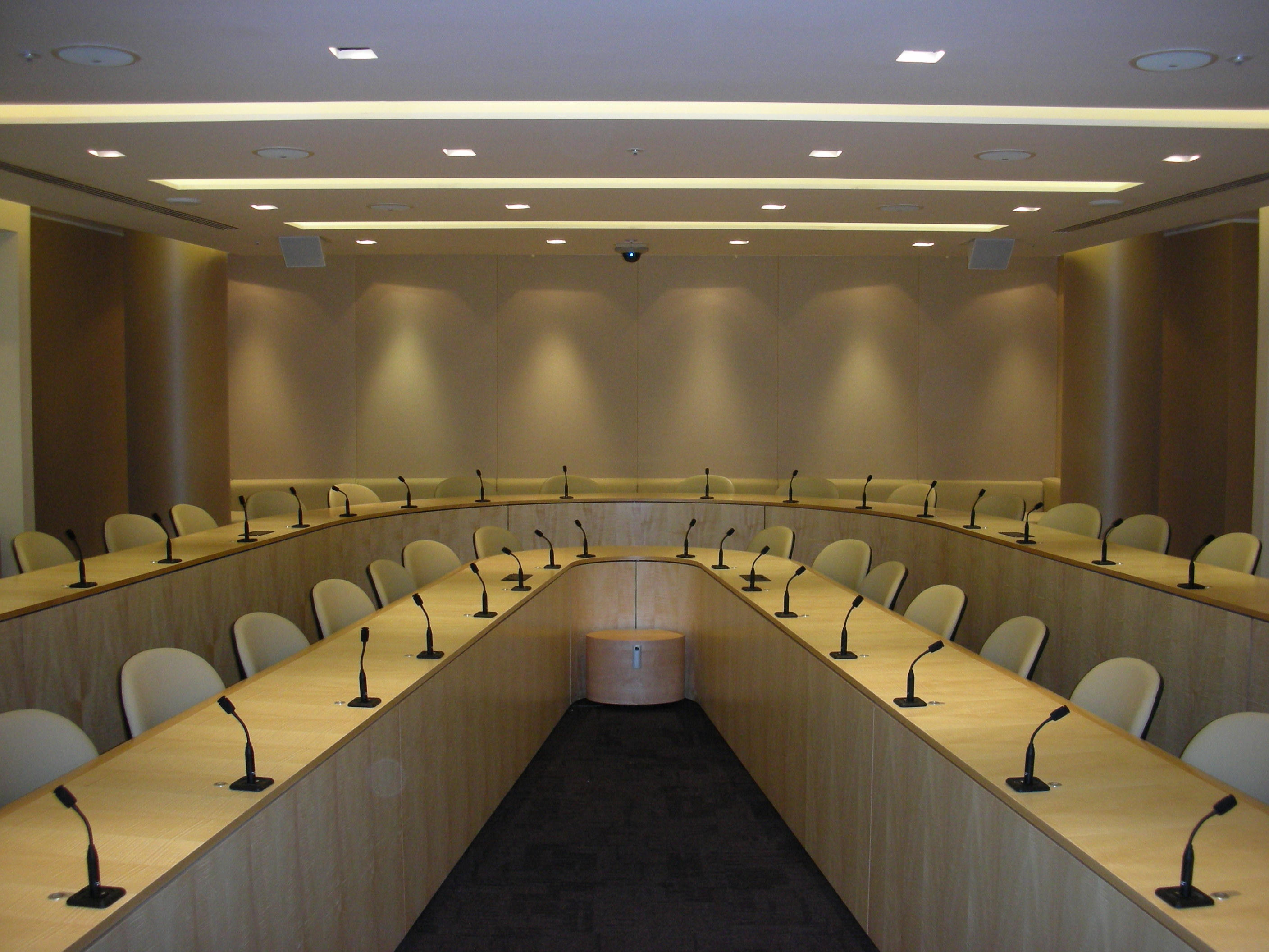 Full-height stretch fabric acoustic wall panels in a corporate conference room